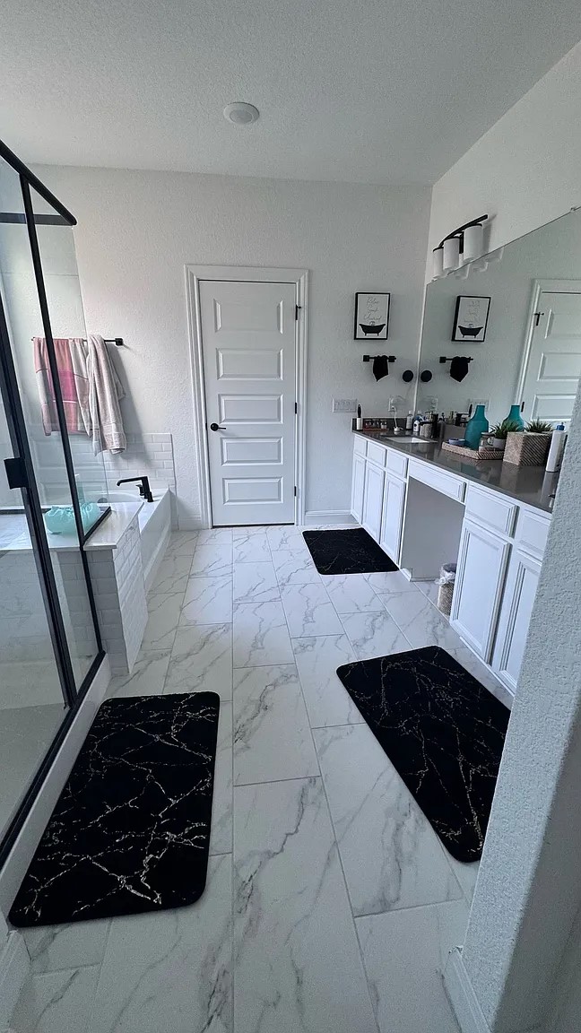 126 Georgia Lace Trail Georgetown, TX 78626 - Photo 14 of 32 a bathroom with a sink a toilet and a mirror