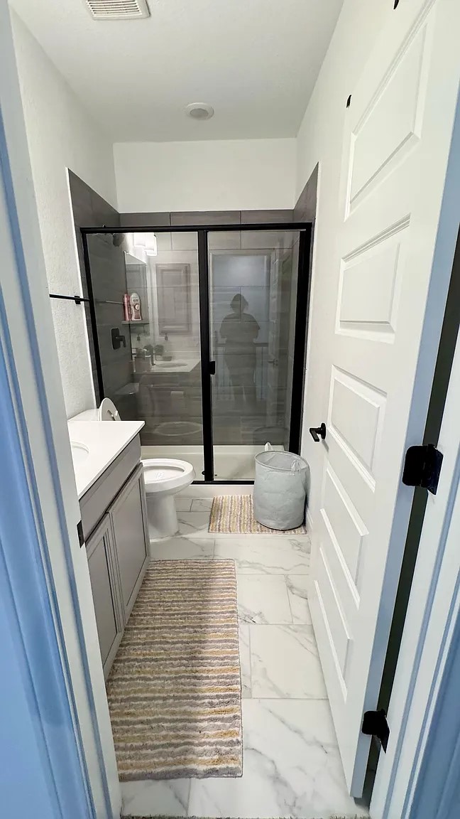 126 Georgia Lace Trail Georgetown, TX 78626 - Photo 20 of 32 a bathroom with a tub shower and a sink