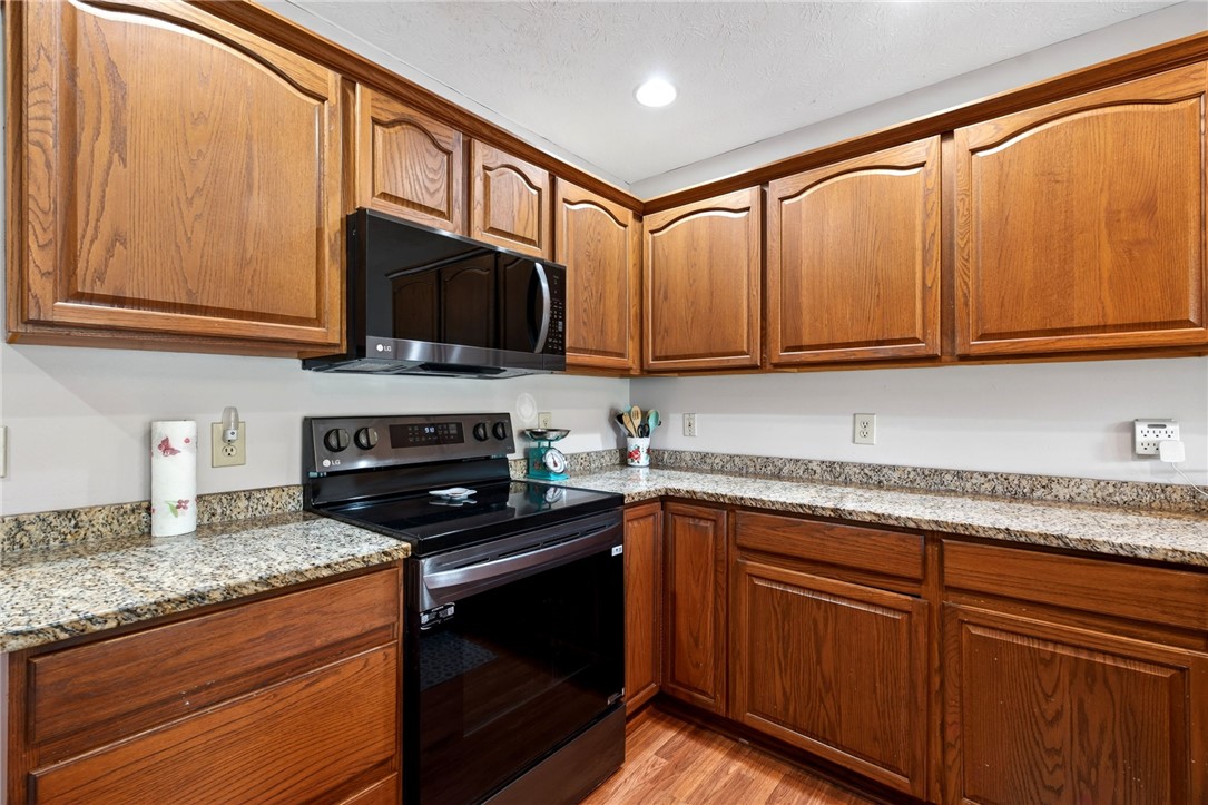 4996 Shannon Avenue Springfield, OH 45504 - Photo 29 of 61 This efficient kitchen features rich cabinetry and practical counter space, perfect for culinary endeavors.