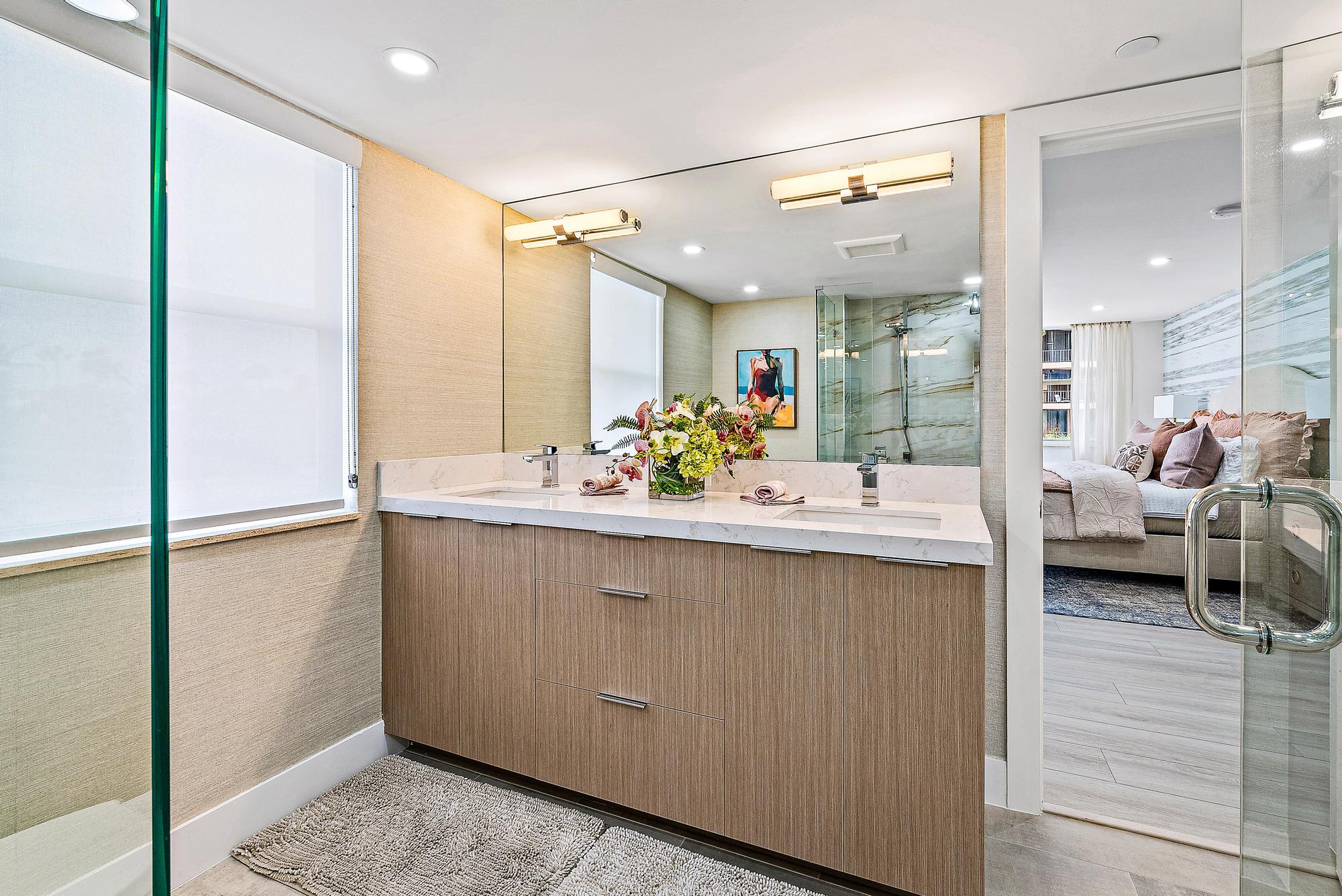 500 Ocean Drive, Unit E2A Juno Beach, FL 33408 - Photo 15 of 40 a bathroom with a sink double vanity and a mirror