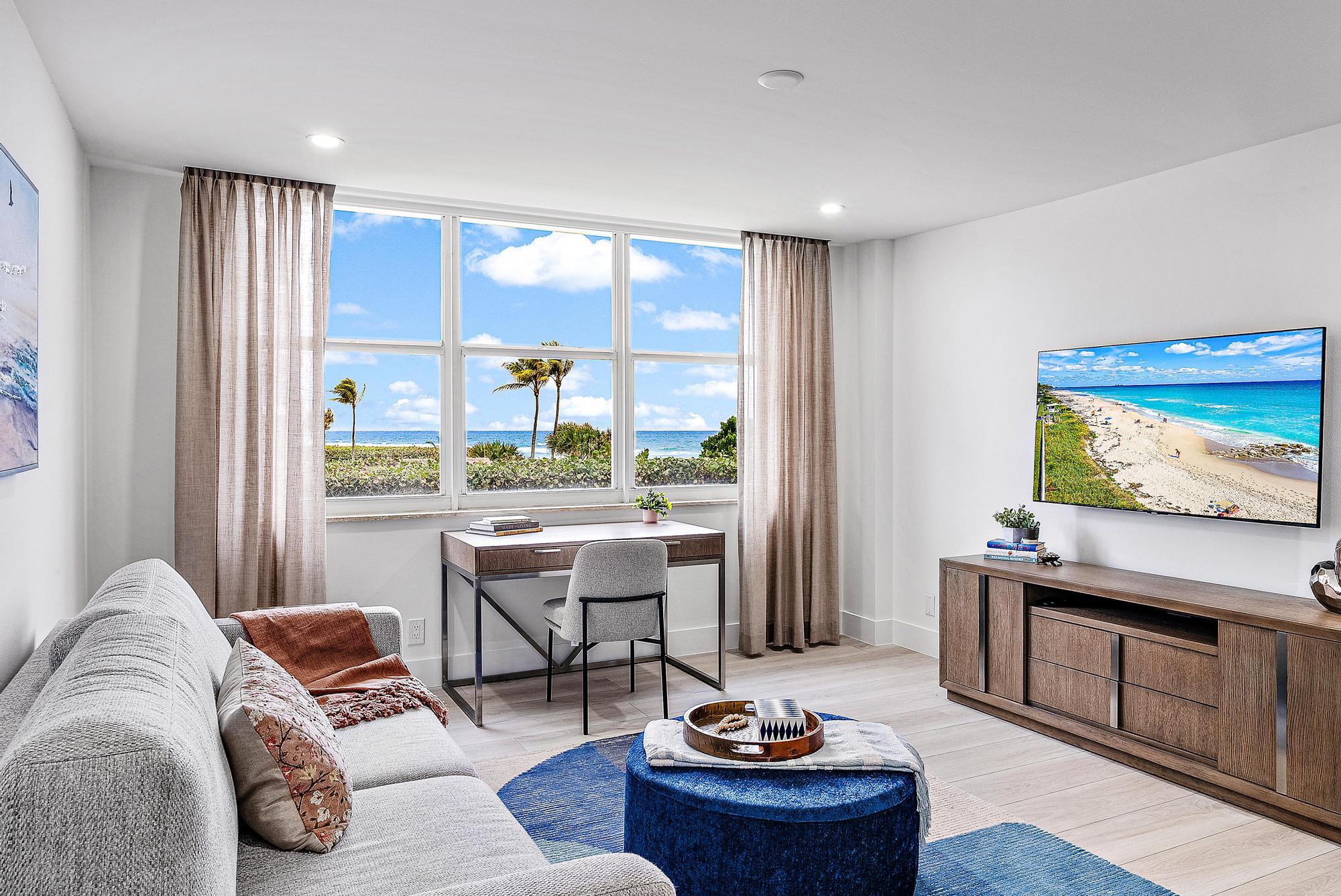 500 Ocean Drive, Unit E2A Juno Beach, FL 33408 - Photo 20 of 40 a living room with furniture and a flat screen tv
