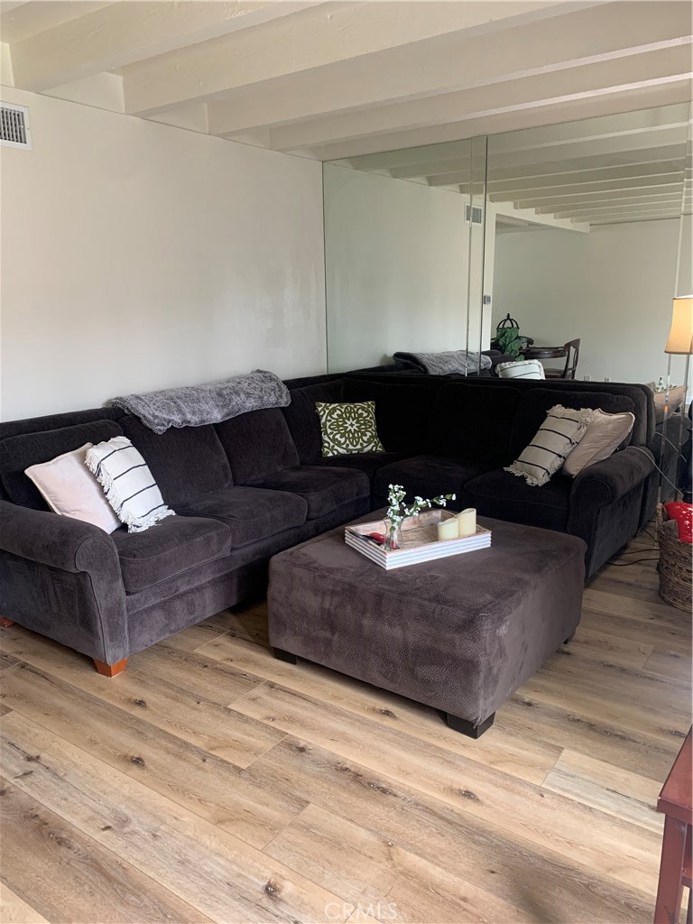 600 West Lambert Road, Unit 44 La Habra, CA 90631 - Photo 5 of 10 a living room with furniture and a wooden floor