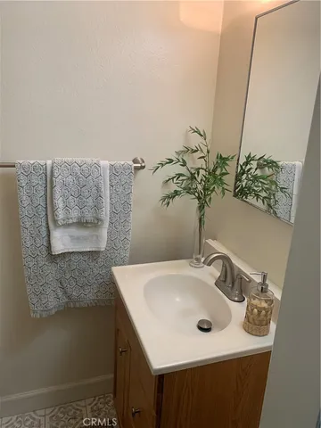 a bathroom with a sink toilet and vanity