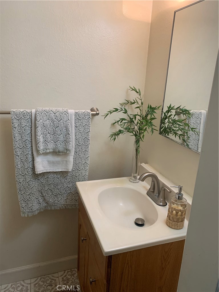 600 West Lambert Road, Unit 44 La Habra, CA 90631 - Photo 7 of 10 a bathroom with a sink and a mirror