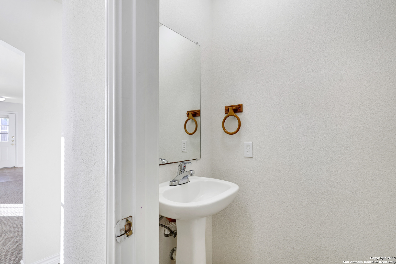 10023 Vasso View, Unit 1 Converse, TX 78109 - Photo 13 of 27 a bathroom with a sink and a mirror