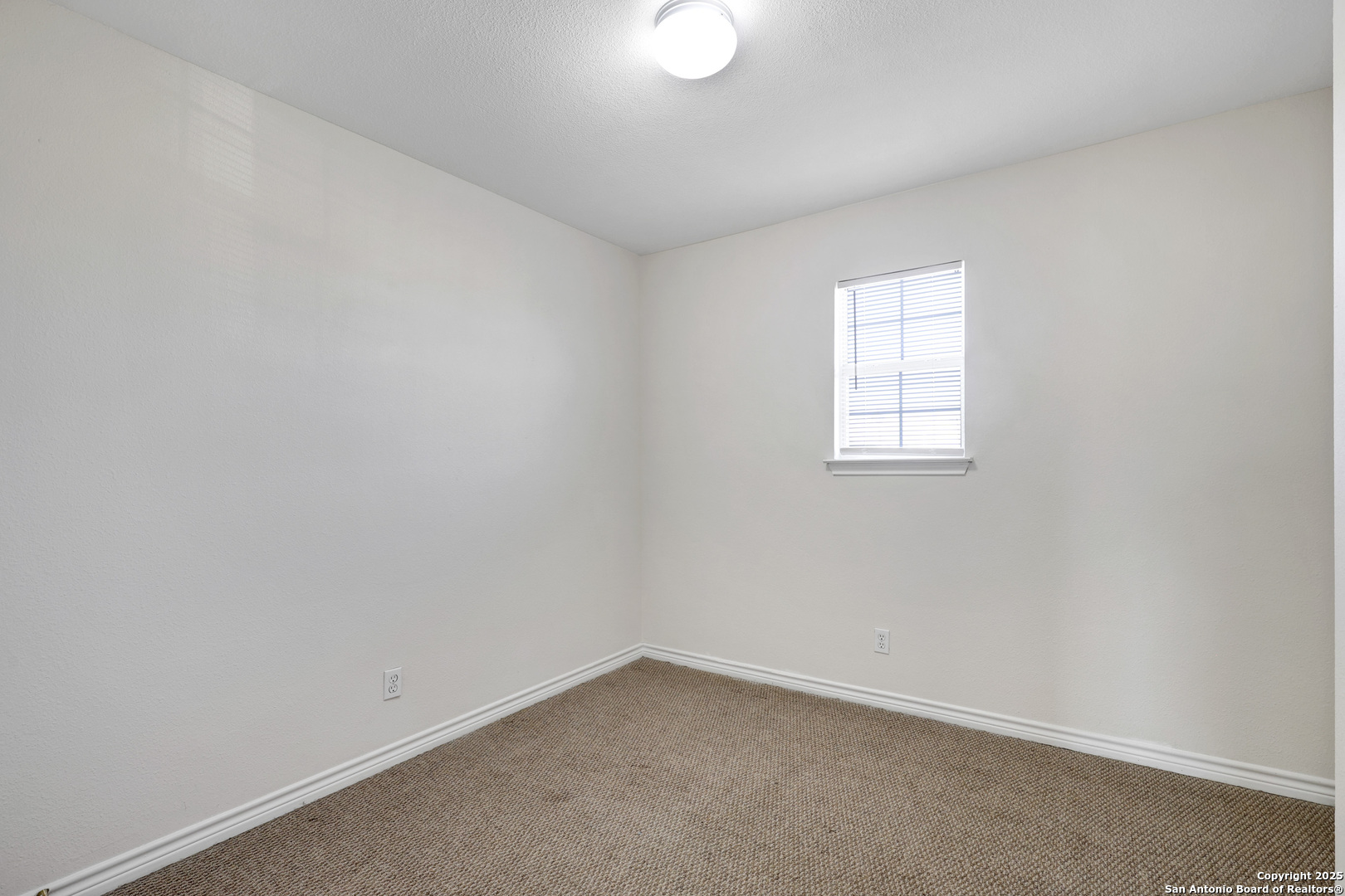 10023 Vasso View, Unit 1 Converse, TX 78109 - Photo 19 of 27 an empty room with a window