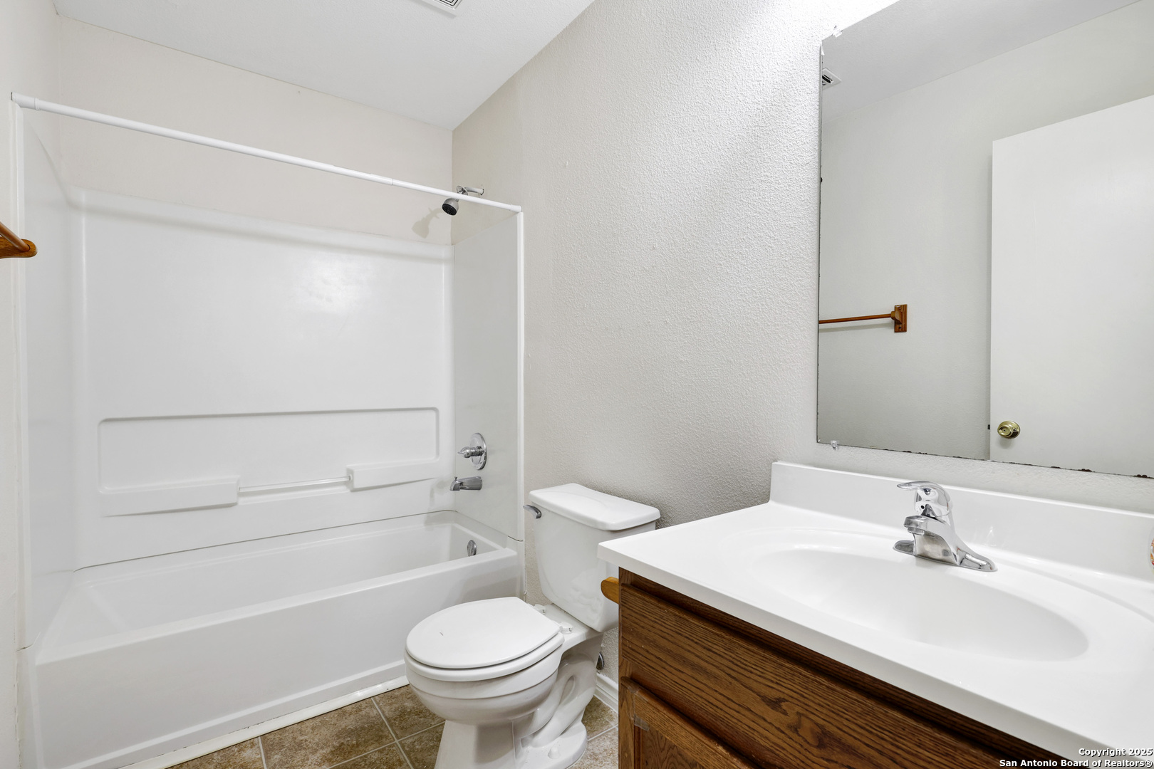 10023 Vasso View, Unit 1 Converse, TX 78109 - Photo 21 of 27 a bathroom with a sink toilet and shower