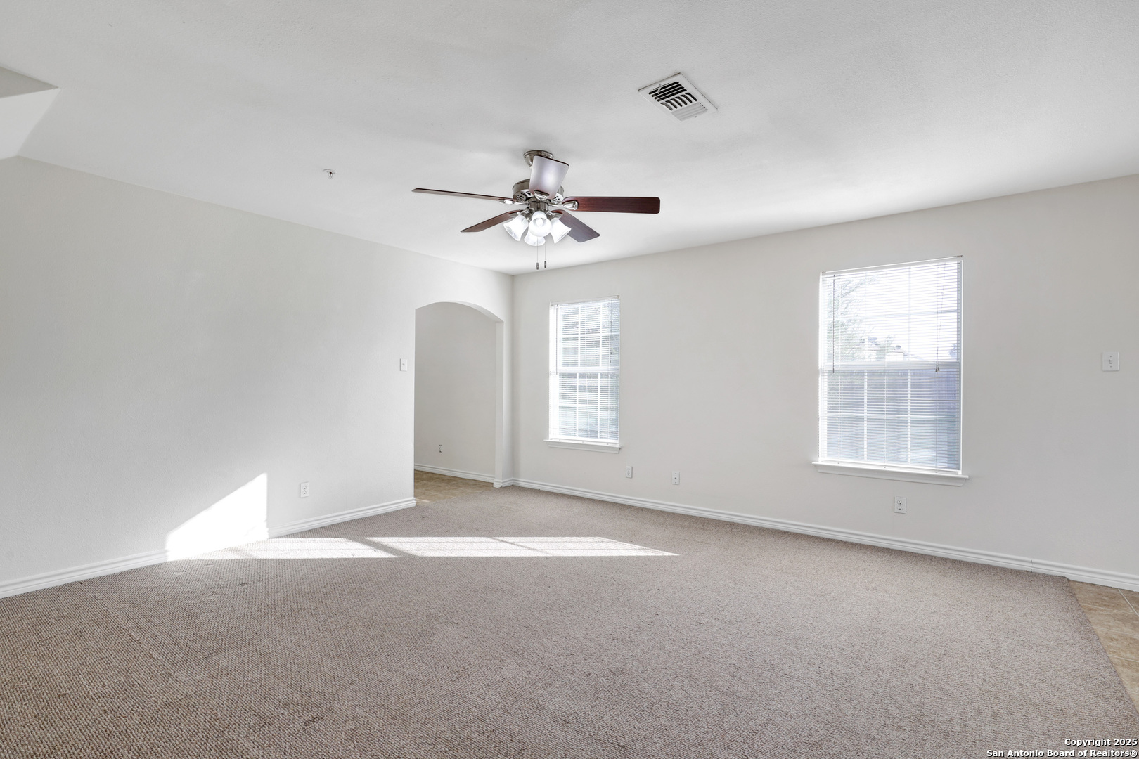 10023 Vasso View, Unit 1 Converse, TX 78109 - Photo 5 of 27 a view of an empty room with a window