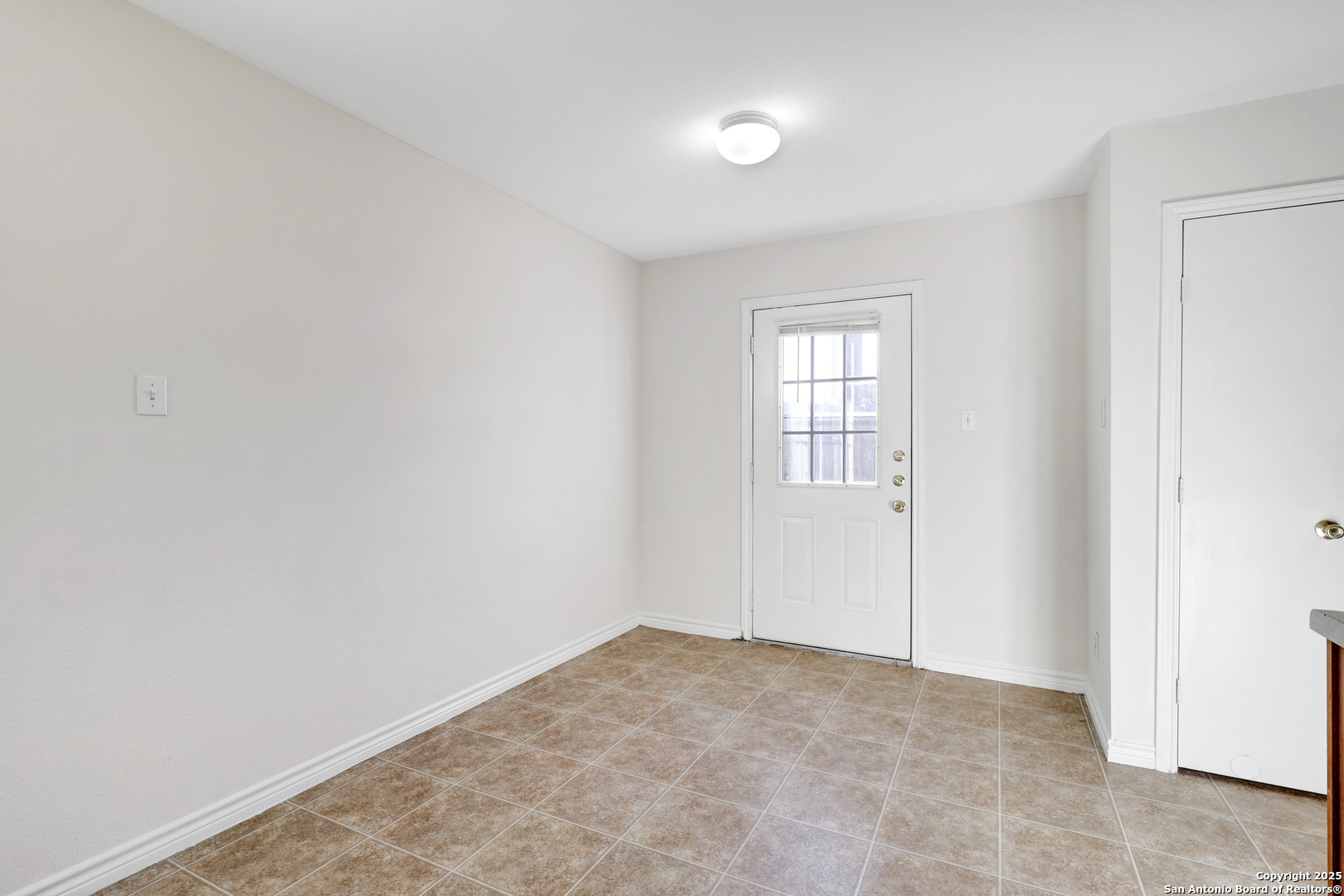 10023 Vasso View, Unit 1 Converse, TX 78109 - Photo 8 of 27 an empty room with windows
