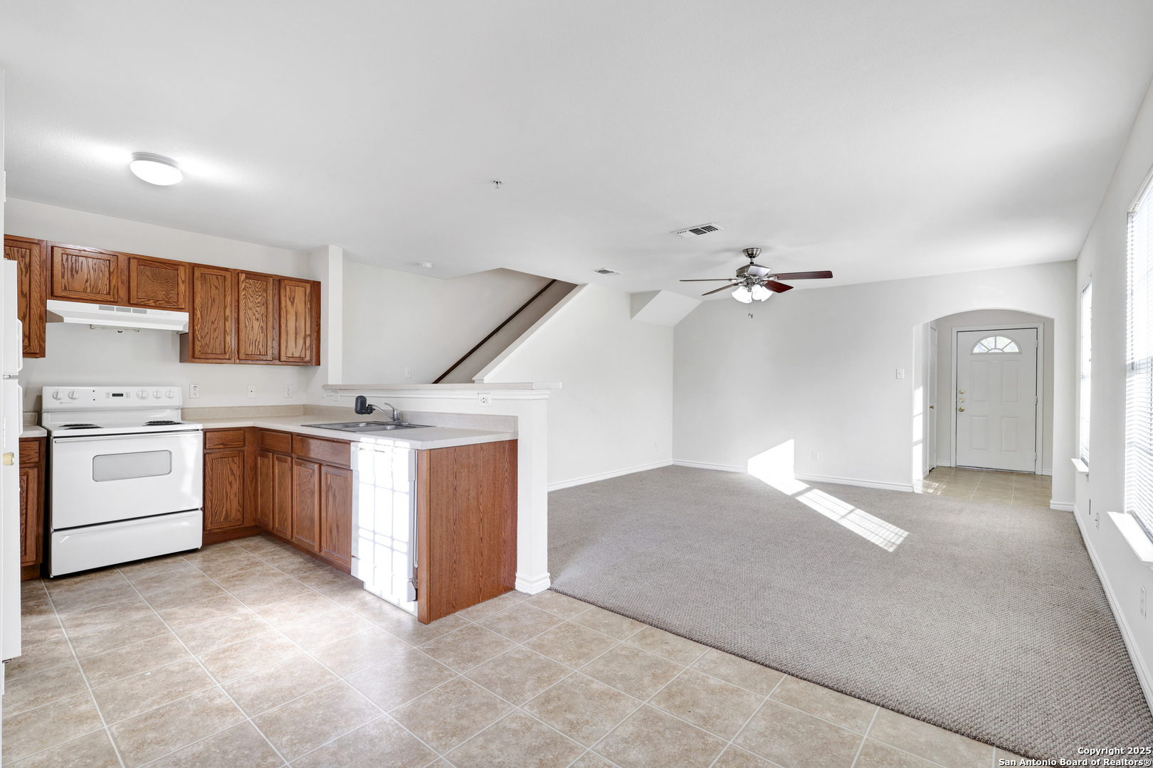 10023 Vasso View, Unit 1 Converse, TX 78109 - Photo 9 of 27 a view of a kitchen with a sink cabinets and window