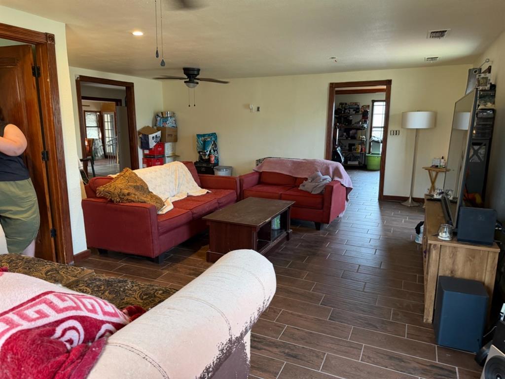 4050 Old Anson Road Abilene, TX 79601 - Photo 13 of 40 a living room with furniture a rug and a flat screen tv