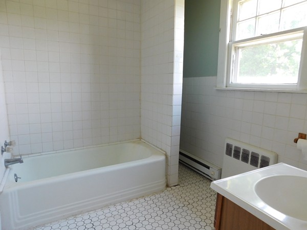 3267 Boston Road Wilbraham, MA 01095 - Photo 9 of 11 a bathroom with a tub a sink and a window