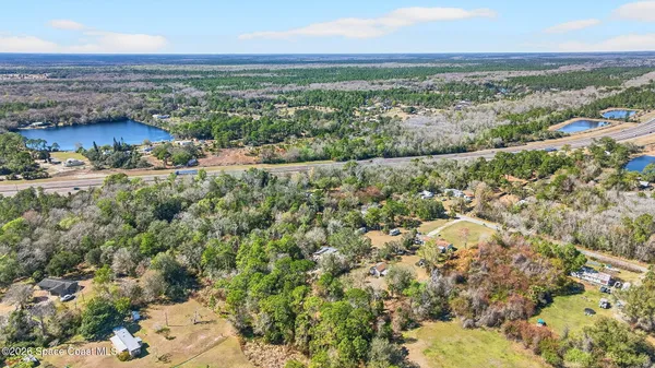 an aerial view of residential building and lake