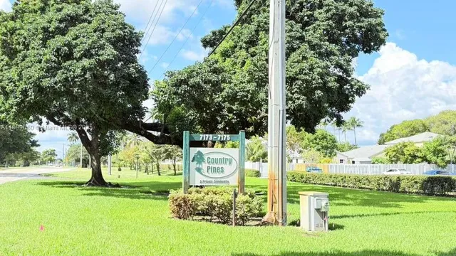a view of a park with swings and slides