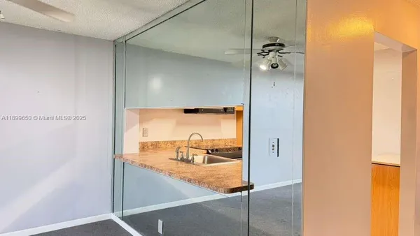 a kitchen with cabinets and stainless steel appliances