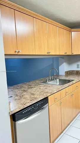 a view of a bathroom from a corridor