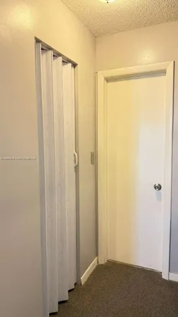 a view of a patio with a table and chairs