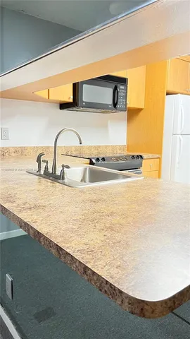 a view of swimming pool is middle and a yard