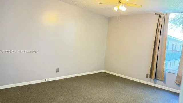 a view of a bathroom with a sink and a mirror