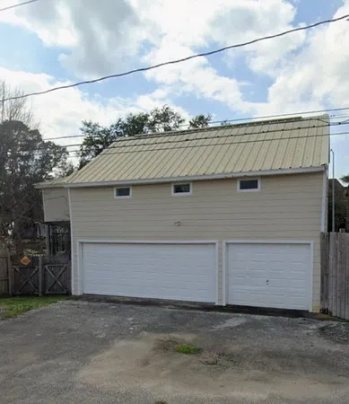 a view of a house with a garage