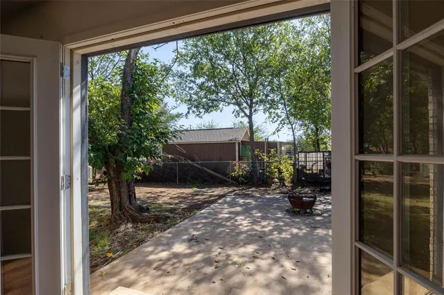 a view of backyard with green space