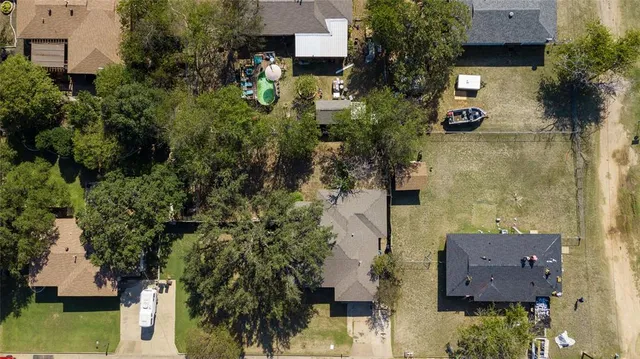 an aerial view of houses with yard