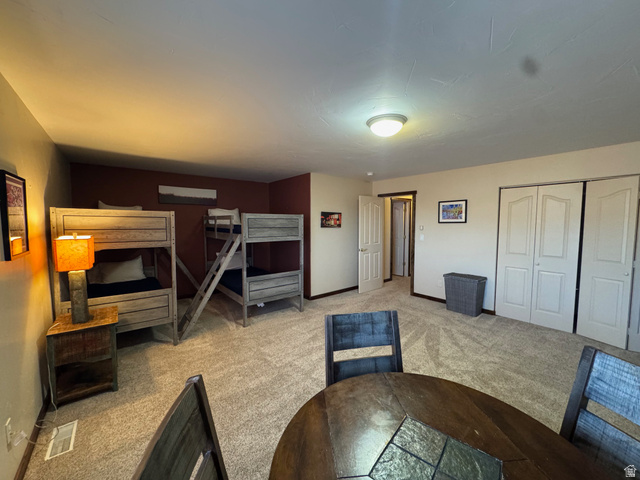 3439 Westwater Road Moab, UT 84532 - Photo 51 of 64 Unfurnished bedroom featuring carpet floors and a closet