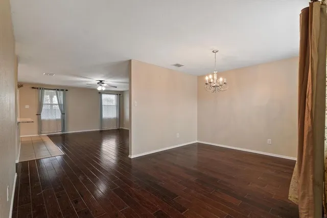 a view of livingroom with hardwood floor and kitchen