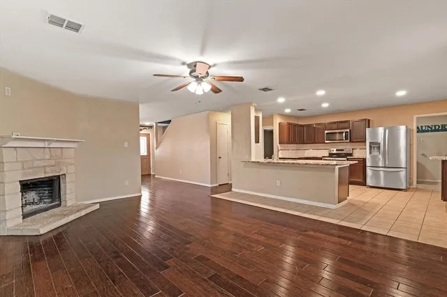 a view of kitchen with cabinets and wooden floor