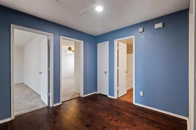 a view of room with wooden floor