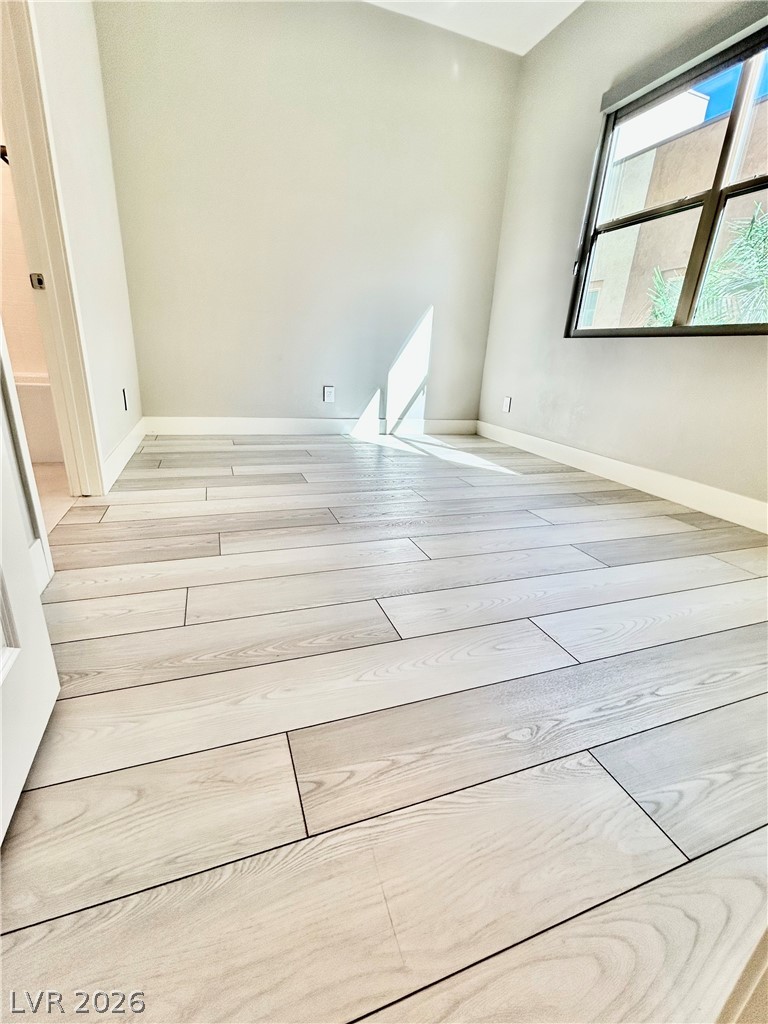 4262 Swift Street Las Vegas, NV 89135 - Photo 64 of 75 Bedroom with light wood finished floors and baseboards