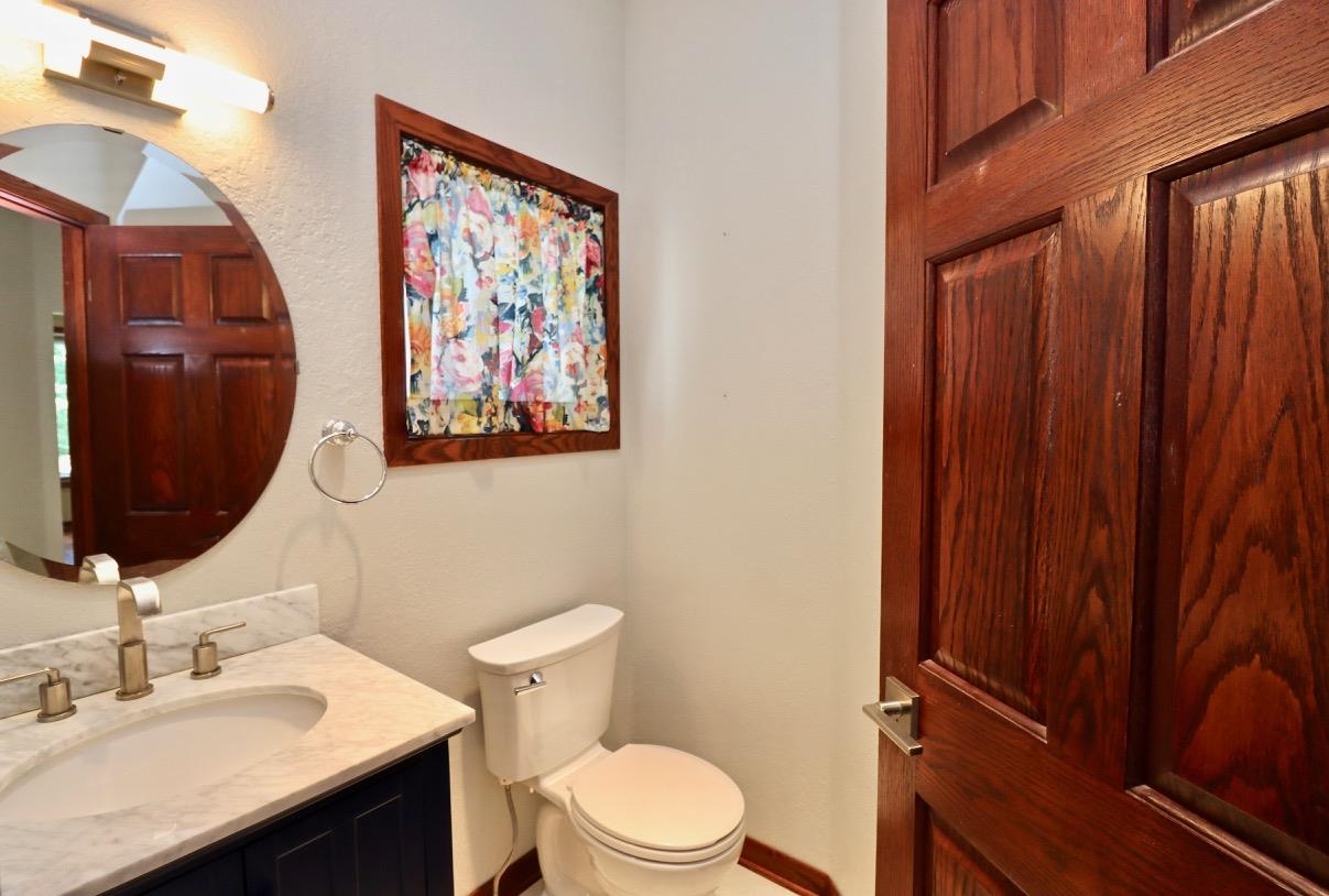 6210 Mc Donald Road Roscoe, IL 61073 - Photo 13 of 41 a bathroom with a sink vanity and toilet