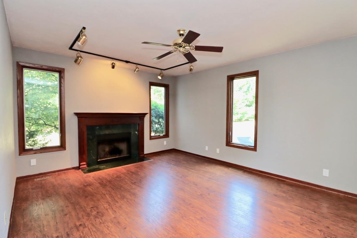 6210 Mc Donald Road Roscoe, IL 61073 - Photo 14 of 41 a view of an empty room with window and fire place