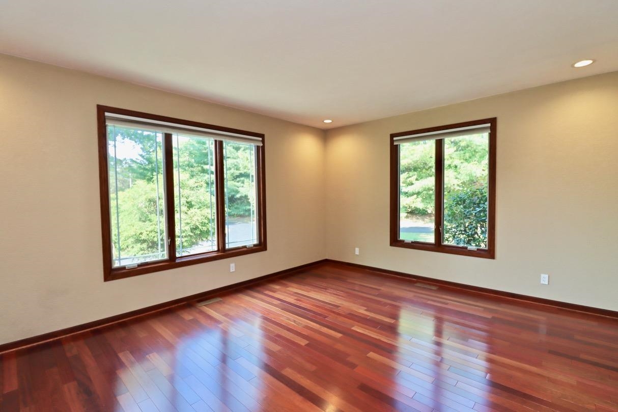6210 Mc Donald Road Roscoe, IL 61073 - Photo 15 of 41 a view of an empty room with wooden floor and a window
