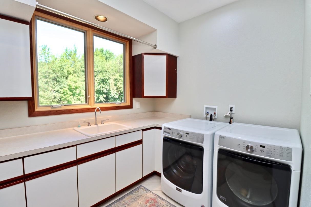 6210 Mc Donald Road Roscoe, IL 61073 - Photo 16 of 41 a utility room with a sink washer and dryer