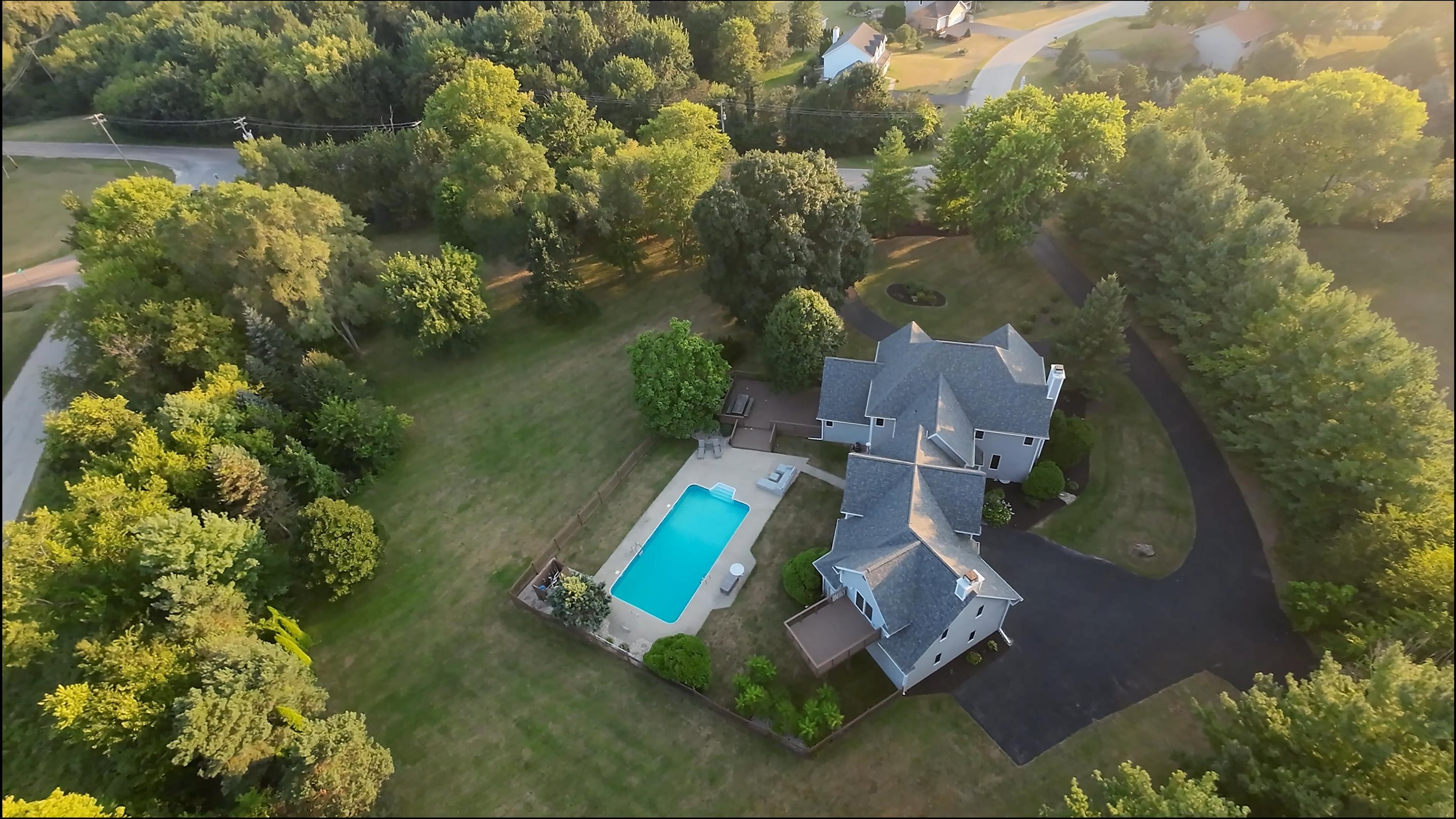 6210 Mc Donald Road Roscoe, IL 61073 - Photo 2 of 41 an aerial view of a house with a yard and lake view
