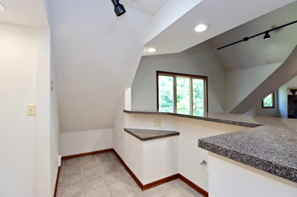 6210 Mc Donald Road Roscoe, IL 61073 - Photo 25 of 41 a kitchen with a sink a counter top space and a window