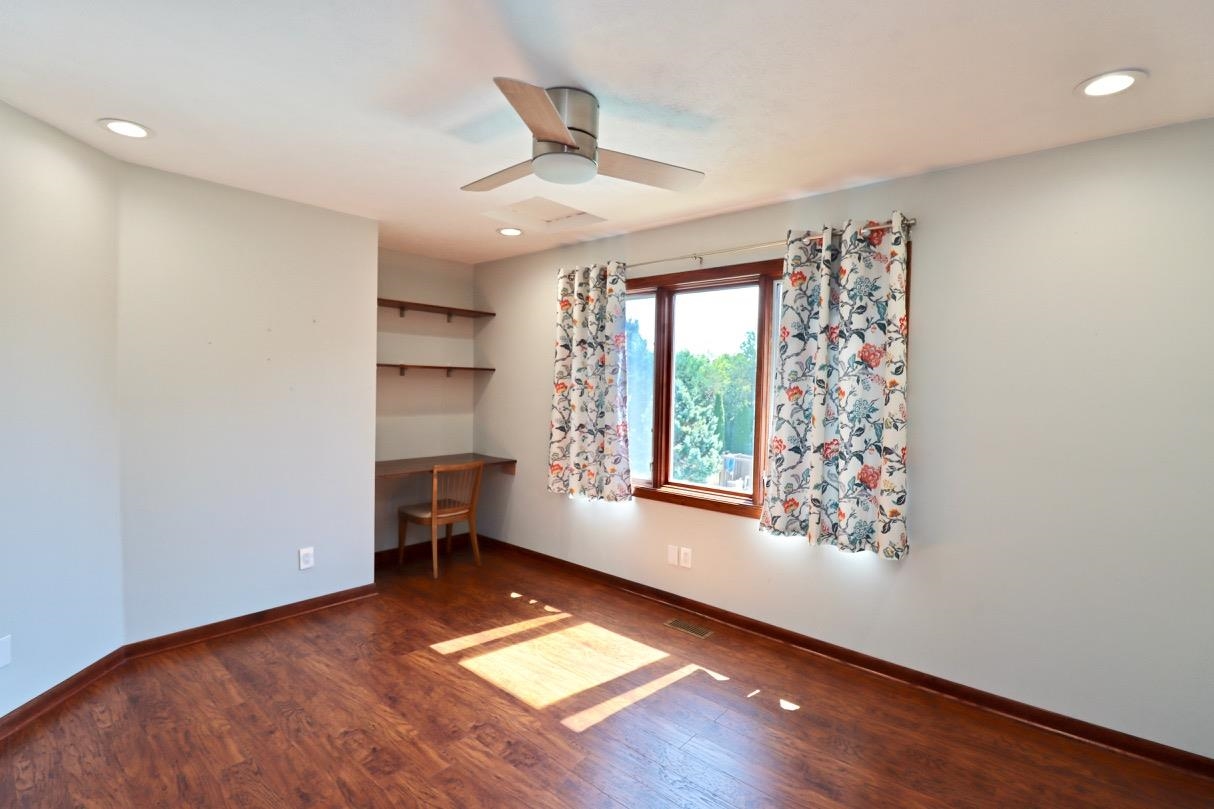 6210 Mc Donald Road Roscoe, IL 61073 - Photo 26 of 41 a view of room with window and wooden floor