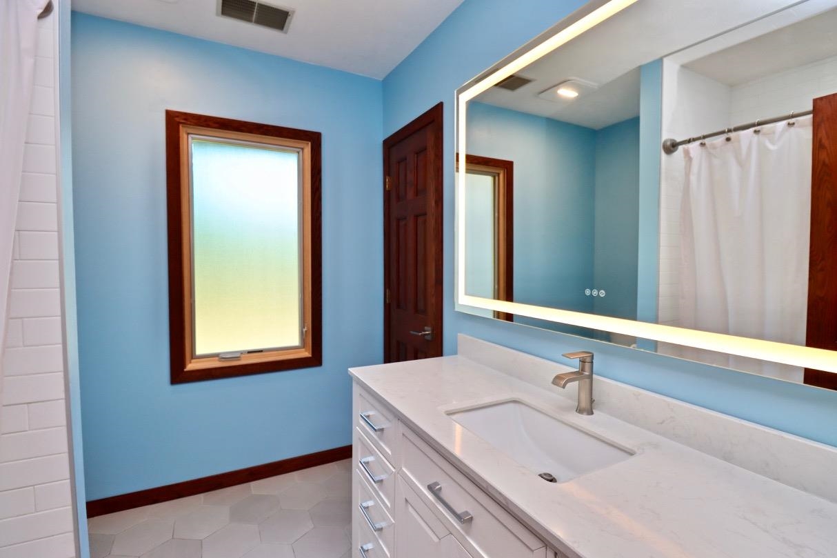 6210 Mc Donald Road Roscoe, IL 61073 - Photo 27 of 41 a bathroom with a sink and a mirror