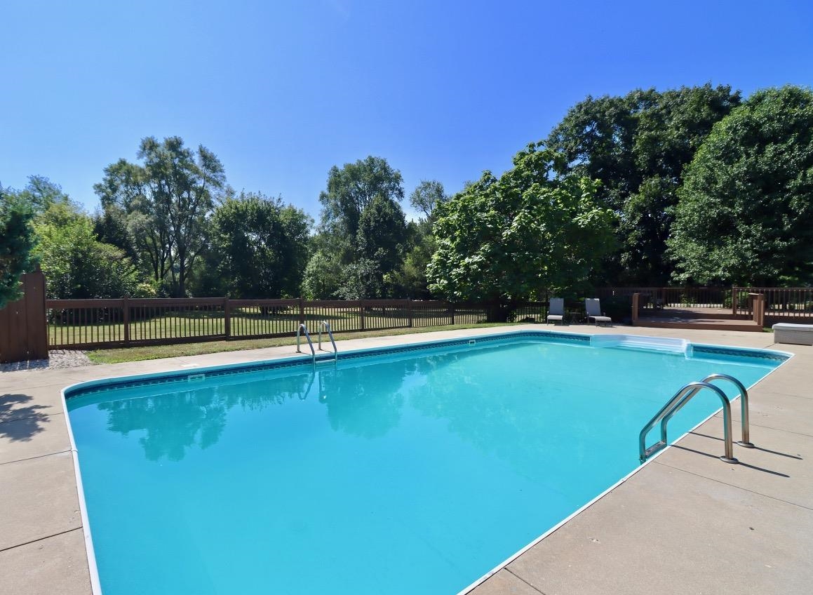 6210 Mc Donald Road Roscoe, IL 61073 - Photo 32 of 41 a view of a swimming pool with an outdoor space and seating area