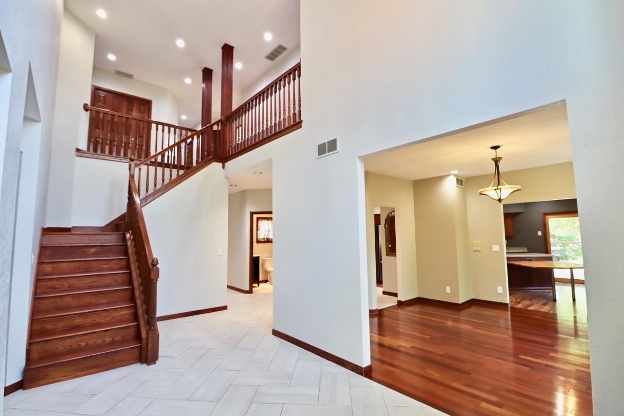 6210 Mc Donald Road Roscoe, IL 61073 - Photo 5 of 41 a view of entryway and hall with wooden floor
