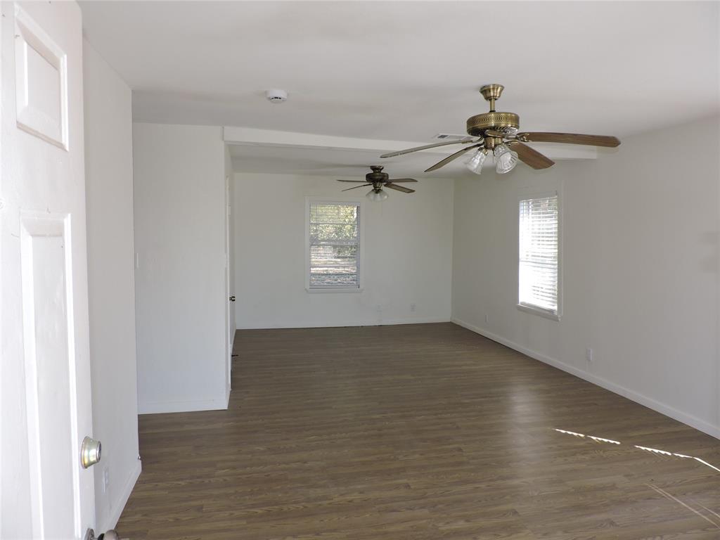 1612 North Anglin Street Cleburne, TX 76031 - Photo 5 of 16 a view of an empty room with a window