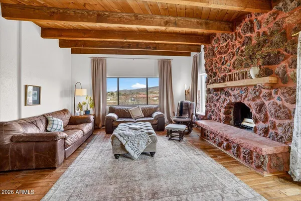 a kitchen with stainless steel appliances granite countertop a refrigerator a stove and a wooden floors