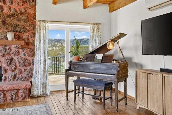 a kitchen with stainless steel appliances granite countertop a refrigerator a stove a sink and dishwasher with wooden floor