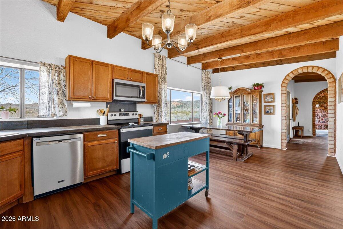 13505 East Rindone Lane Cornville, AZ 86325 - Photo 15 of 73 a kitchen with stainless steel appliances granite countertop a stove and cabinets with wooden floor