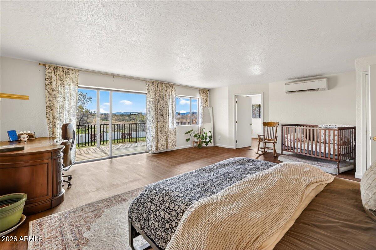 13505 East Rindone Lane Cornville, AZ 86325 - Photo 24 of 73 a spacious bedroom with a bed and a large window