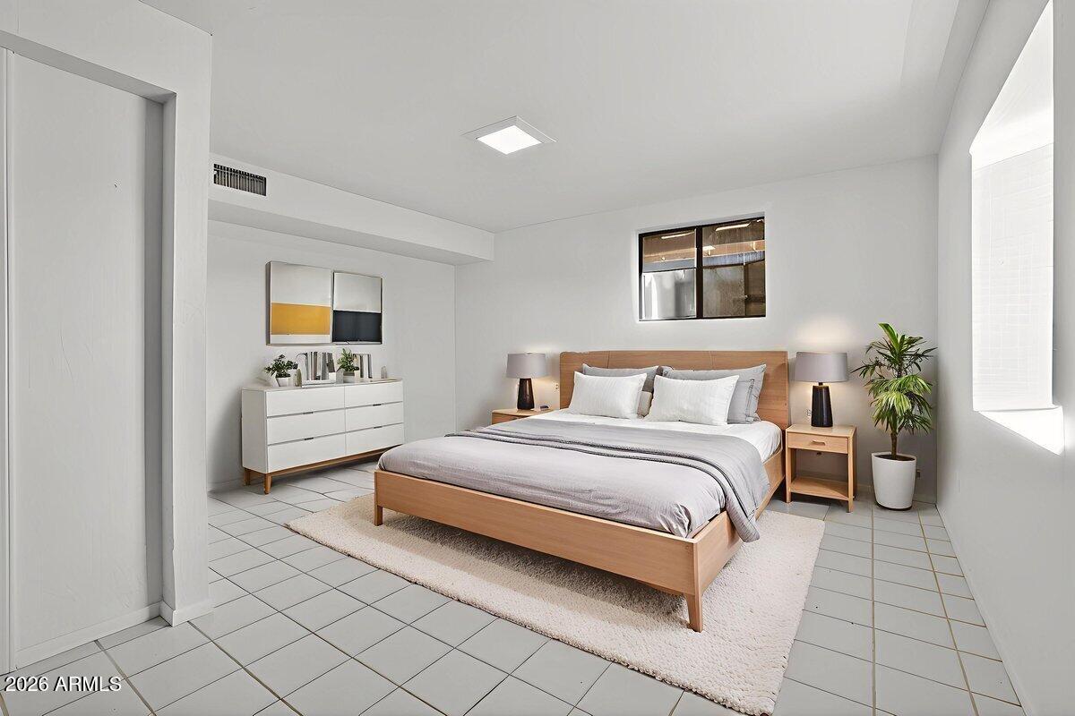 13505 East Rindone Lane Cornville, AZ 86325 - Photo 42 of 73 a spacious bedroom with a bed and a couch