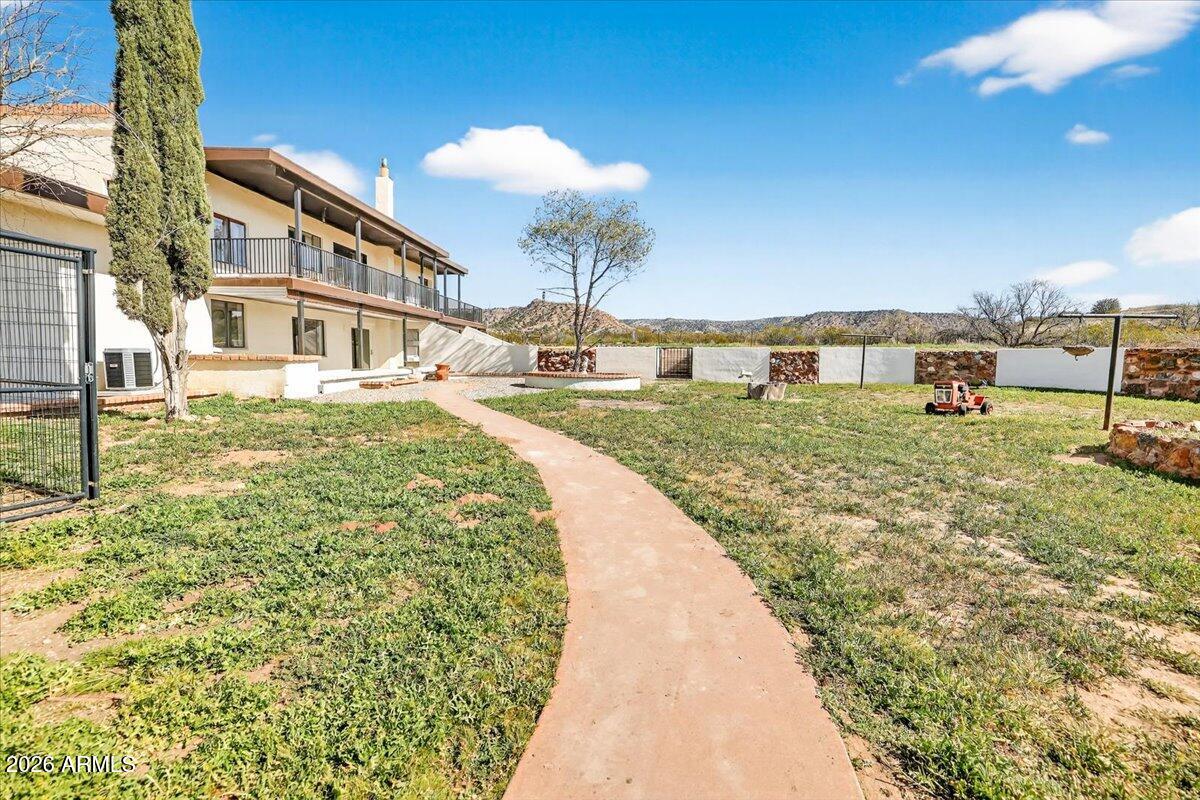 13505 East Rindone Lane Cornville, AZ 86325 - Photo 55 of 73 a front view of a house with a garden
