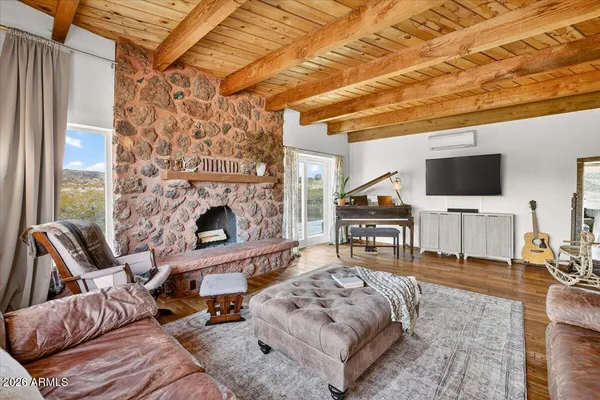 a living room with furniture and a large window