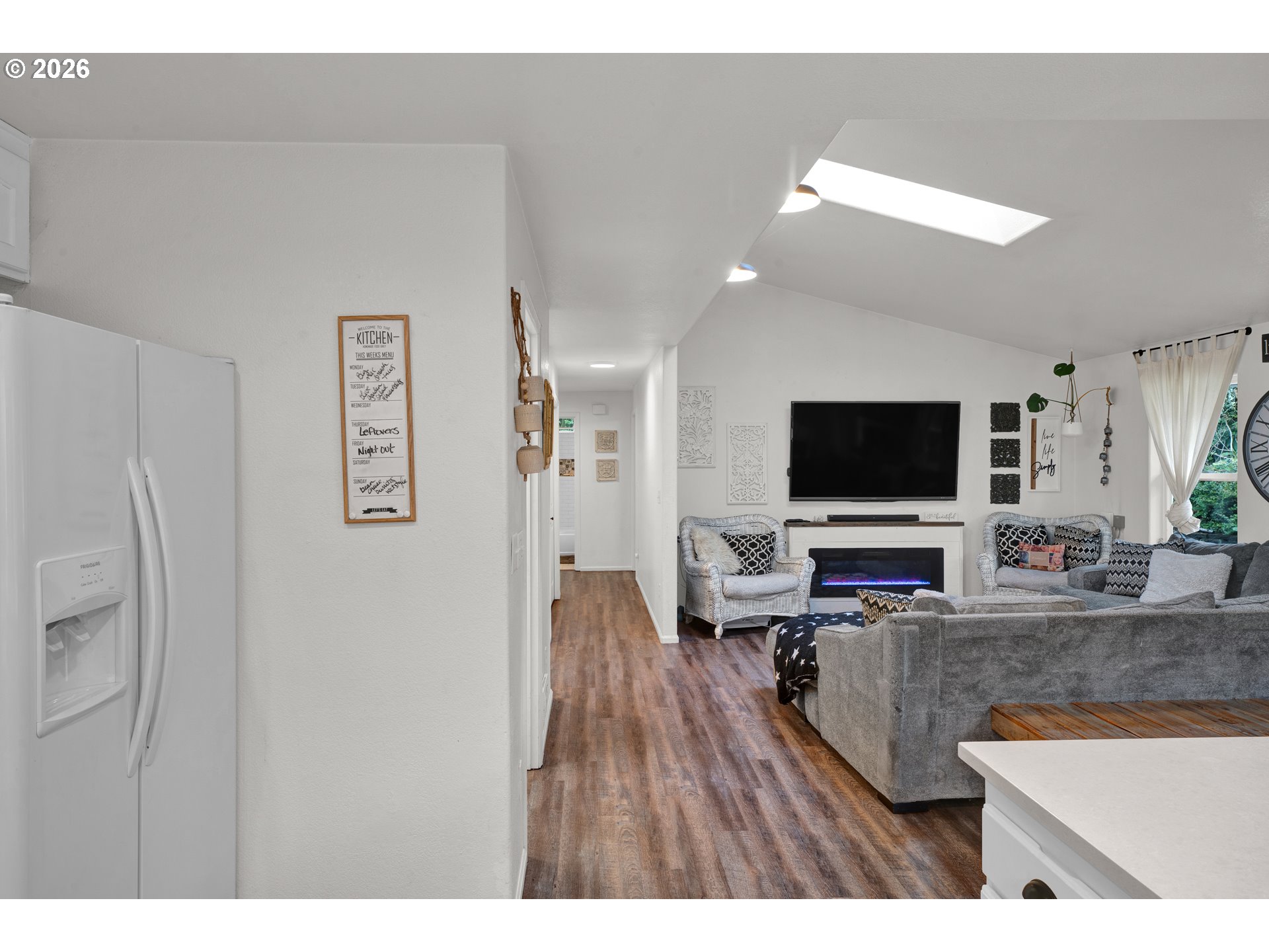 1265 Laurel Street Florence, OR 97439 - Photo 14 of 42 a living room with furniture and a flat screen tv